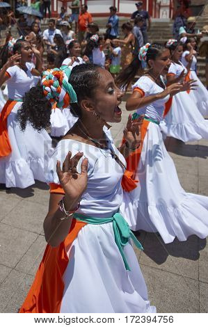 ARICA, ARICA and PARINACOTA, CHILE - FEBRUARY 10, 2017: Female dancers from the group Tumba Carnaval, performing at the annual street carnival celebrating the strength of the sun.