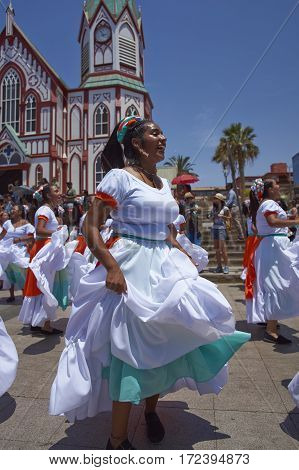 ARICA, ARICA and PARINACOTA, CHILE - FEBRUARY 10, 2017: Female dancers from the group Tumba Carnaval, performing at the annual street carnival celebrating the strength of the sun.
