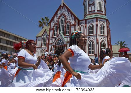 ARICA, ARICA and PARINACOTA, CHILE - FEBRUARY 10, 2017: Female dancers from the group Tumba Carnaval, performing at the annual street carnival celebrating the strength of the sun.