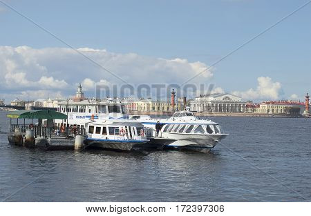 SAINT PETERSBURG, RUSSIA - MAY 04, 2015: Tourist pier on the background of the spit of Vasilyevsky island
