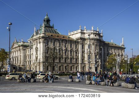 MUNICH, GERMANY - OCTOBER 31, 2015: The palace of justice in Munich is a judicial and administrative building in the Bavarian capital unidentified people are walking along