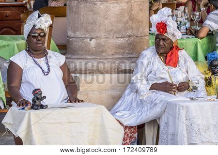 La Havana Cuba - December 26 2016: cuban portrait series two orisha's women on touristic place on street
