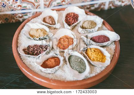 Spices in white bowls shells. Different spices