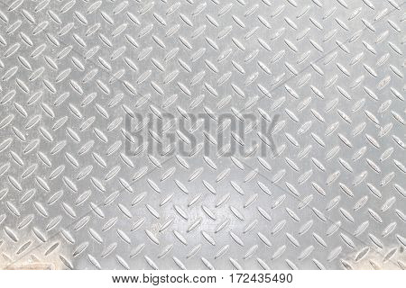 A metal background or texture with tread plate pattern