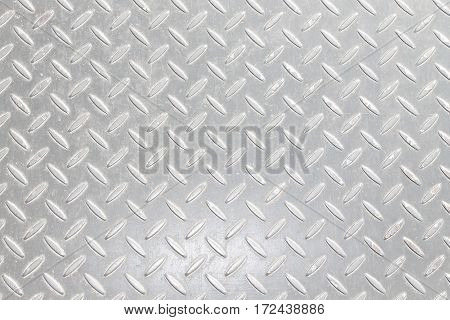 A metal background or texture with tread plate pattern