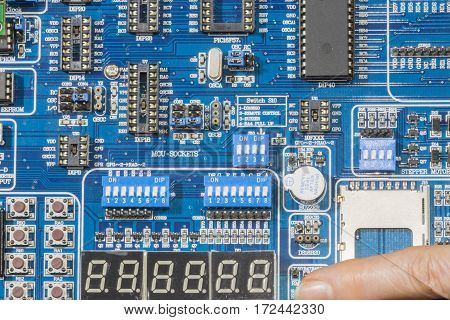 A person presses the switch the  a  Microcontroller Development board