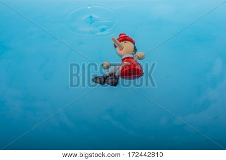 Wodden Puppet Pinocchio In Water