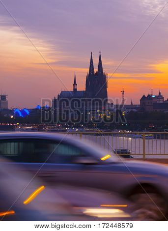 Cologne Cathedral. Cars driving on a bridge over the Rhine