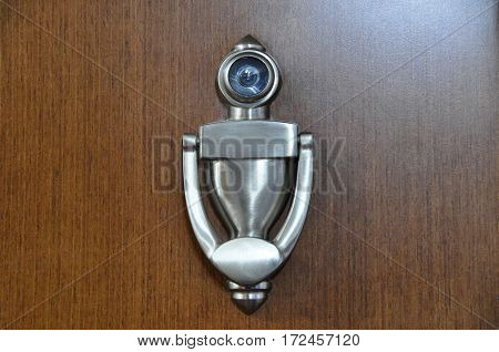 A wooden doors and metal door handle