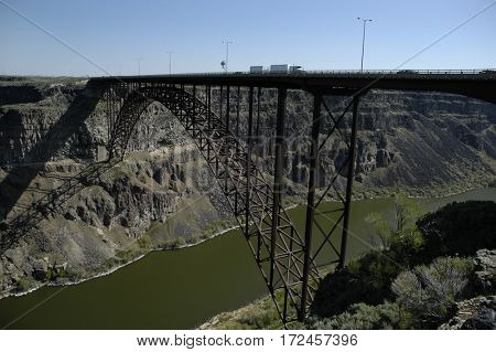 Traffic Big Trucks Transportation Driving Over Bridge Spanning Canyon and River