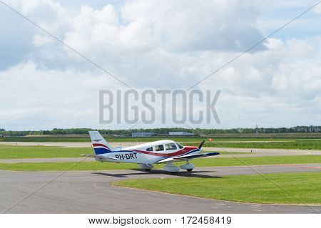 LELYSTAD NETHERLANDS - MAY 15 2016: Light aircraft taxiing to the runway on Lelystad airport