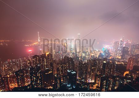 Beautiful super wide-angle summer aerial view View of Hong Kong island skyline, Victoria Bay harbor, with skyscrapers, blue sky and scenery beyond the city, seen from Kowloon island observation Deck