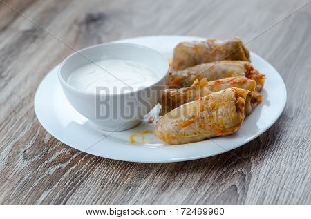 stuffed cabbage - a traditional Ukrainian cuisine braised cabbage leaves stuffed with minced meat and rice with sour cream
