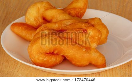 'patongko' thai and chinese food deep fried for breakfast on plate white