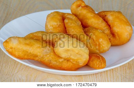 'patongko' thai and chinese food deep fried for breakfast on plate white