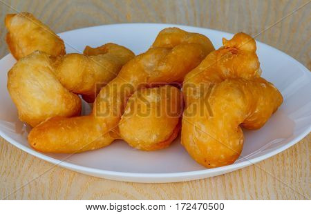 'patongko' thai and chinese food deep fried for breakfast on plate white