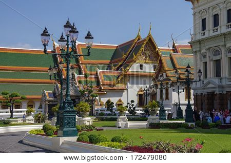 Bangkok, Thailand - July 25, 2010: Roayl Great (Grand) Palace Buddhist temple with famous green tree gardens in center of Bangkok Thailand