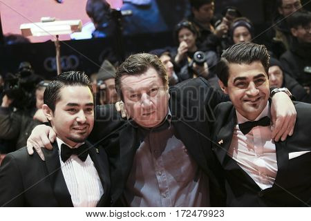 Sherwan Haji, director Aki Kaurismaki, Simon Hussein Al-Bazoon arrive for the closing ceremony of the 67th Berlinale  Festival Berlin at Berlinale Palace on February 18, 2017 in Berlin, Germany.