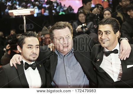 Sherwan Haji, director Aki Kaurismaki, Simon Hussein Al-Bazoon arrive for the closing ceremony of the 67th Berlinale  Festival Berlin at Berlinale Palace on February 18, 2017 in Berlin, Germany.