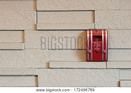 A Fire Alarm Pull Box On A Wall.
