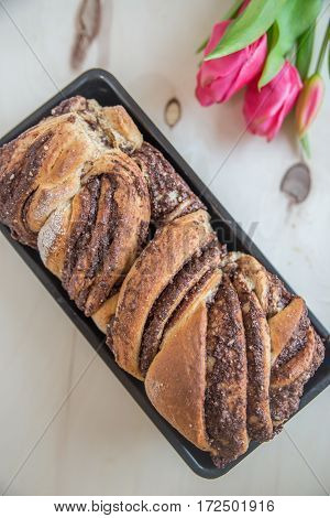 Home made Loaf of chocolate babka on a table