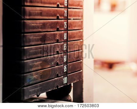 Stack of rusty metal weights in gym bodybuilding equipment. Bodybuilding concept. Hign contrast and monochrome color tone