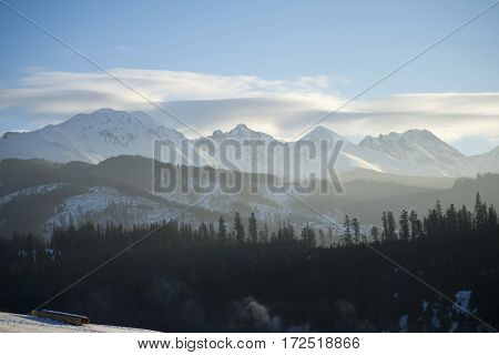 Winter mountains covered with snow view from a big meadow in Tatry mountains in Poland