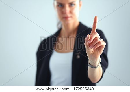 Woman touching an imaginary screen with her finger
