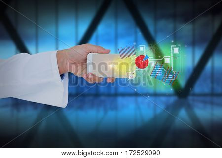 Male doctor holding smart phone with digital effets against room with large window looking on city