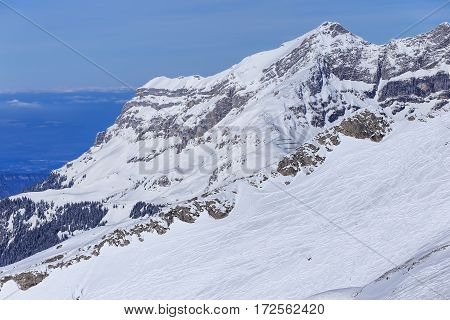 Wintertime view from Mt. Titlis in Switzerland. The Titlis is a mountain, located on the border between the Swiss cantons of Obwalden and Bern.