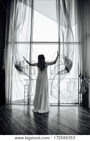 Beautiful Woman Opens The Curtains In The House