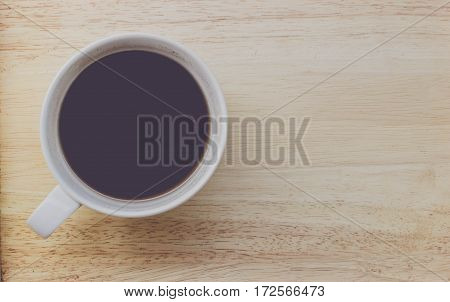 coffee bean and coffee mug on wood background