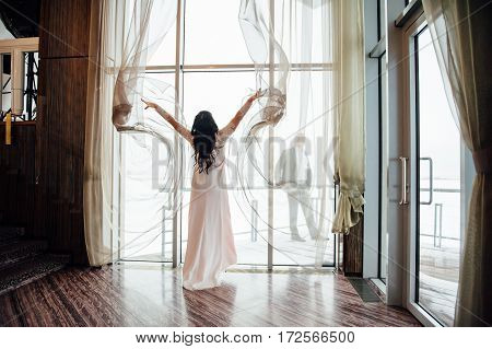 Beautiful Woman Opens The Curtains In The House