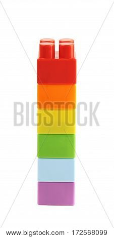 Single stack of the plastic construction toy bricks isolated over the white background