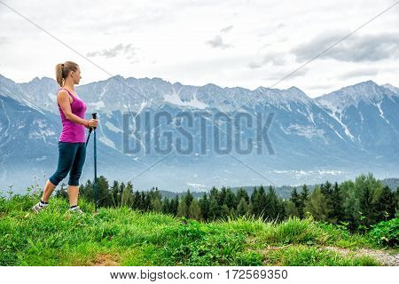 Young woman without backpack hiking in the mountains Alps. Austria. Insbruk