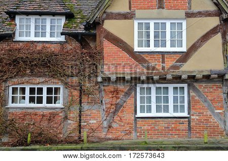 WINCHESTER, UK - FEBRUARY 5, 2017:  Exterior facade of a half timbered house on Kingsgate Street with colorful bricks