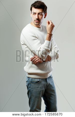portrait of young handsome man posing in studio