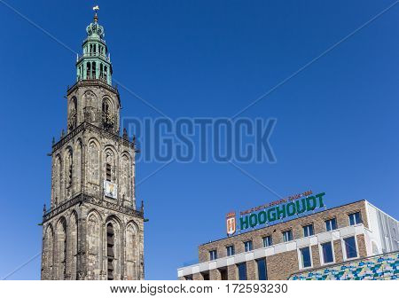 GRONINGEN, NETHERLANDS - FEBRUARY 15, 2017: Martini tower and Vindicat building in Groningen, Holland