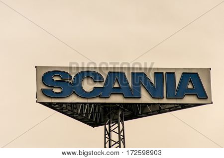 Koblenz, Germany - 20.02.2017 : Sign tower Scania trucks Logo against cloudy sky sunset at german service headquater