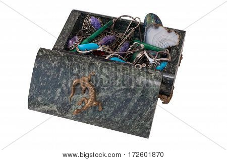 Dark green casket of serpentinite with jewelry on a white background closeup