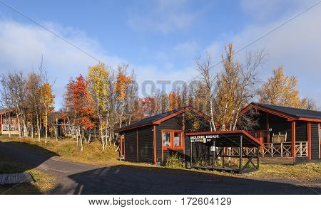 LAPLAND, SWEDEN ON SEPTEMBER 21. Modern, wooden cabin, lodge close to the Hotel Fjallet on September 21, 2016 in Lapland, Sweden. Sunny morning in the autumn, fall. Editorial use.