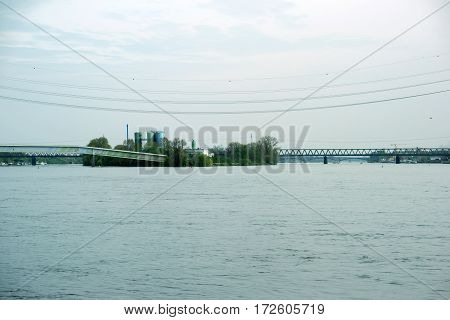 The river Rhine near Mainz and Wiesbaden on the Petersaue with the Emperor bridge and pedestrian bridge.