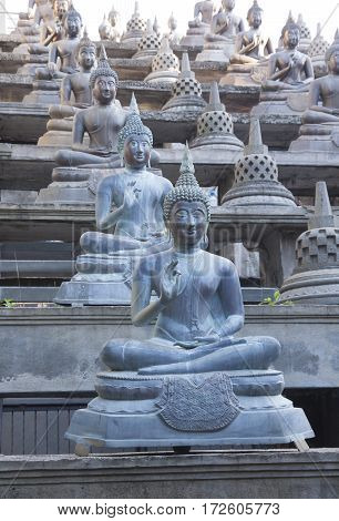 Buddhist statue in Gangaramaya Temle. Sri Lanka