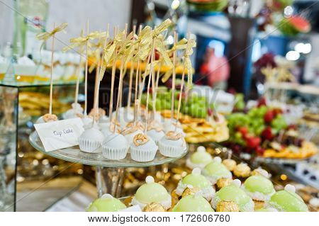Differrent Cup Cakes At Wedding Reception Table.
