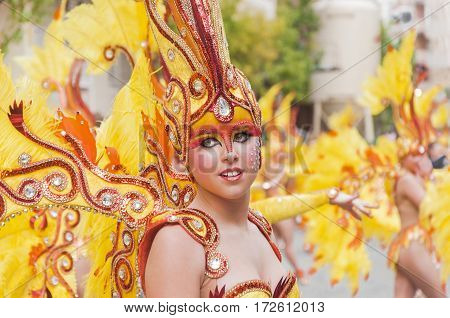 Portrait of young girl at costumed characters parade through the streets of the city. FEBRUARY 17 2015 Torrevieja Spain.