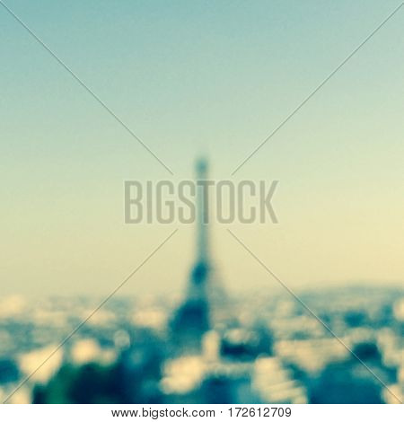 Blurred photo of a landscape with the Eiffel tower recognizable in the background