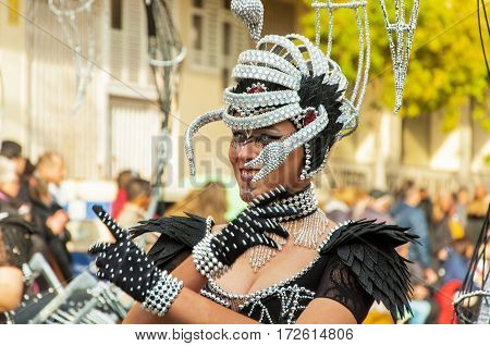 Portrait of young girl at parade costumed characters through the streets of the city. FEBRUARY 17 2015 Torrevieja Spain.