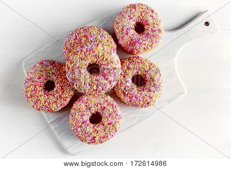 Iced doughnut rings with rainbow sparkl strands
