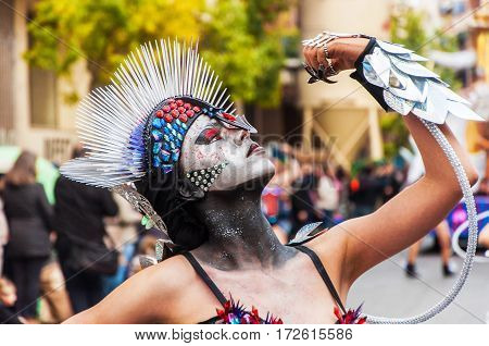 Portrait of young girl at parade costumed characters through the streets of the city. FEBRUARY 17 2015 Torrevieja Spain.