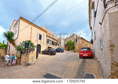 CAPDEPERA/ SPAIN - JUNE 16. Tourists on the streets of the old village Capdepera on June 16, 2016. Island Majorca, Spain.